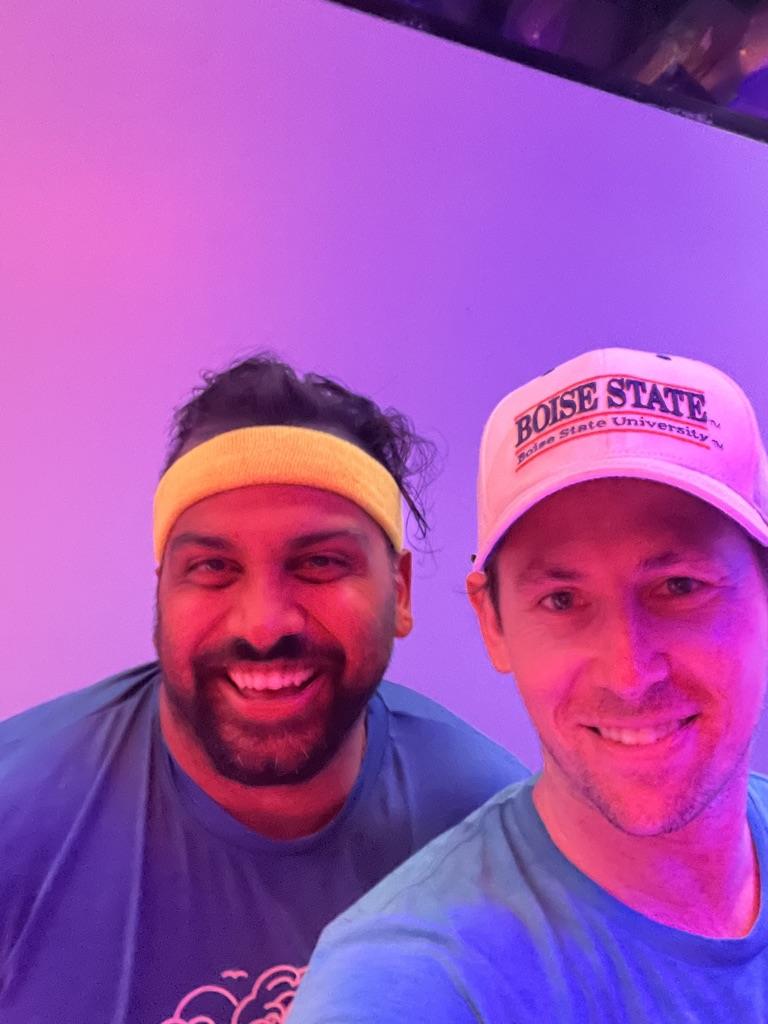 Aaron and Nipun in pink studio lighting after Bis and Tris